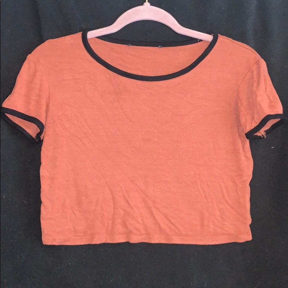 AFaded orange crop top